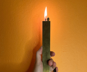 The Rulighter Brass Ruler Lighter Hides Firepower and a Blade