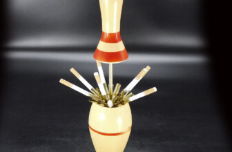 Strike Gold with the Vintage Bowling Pin Lighter & Dispenser